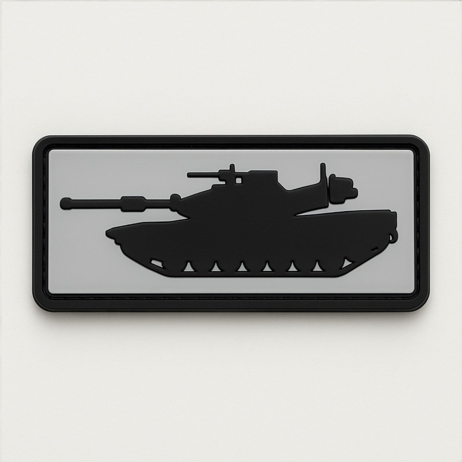 Rectangular PVC patch with black silhouette of a battle tank on a gray background – modern military-themed patch for tactical gear or collectors.