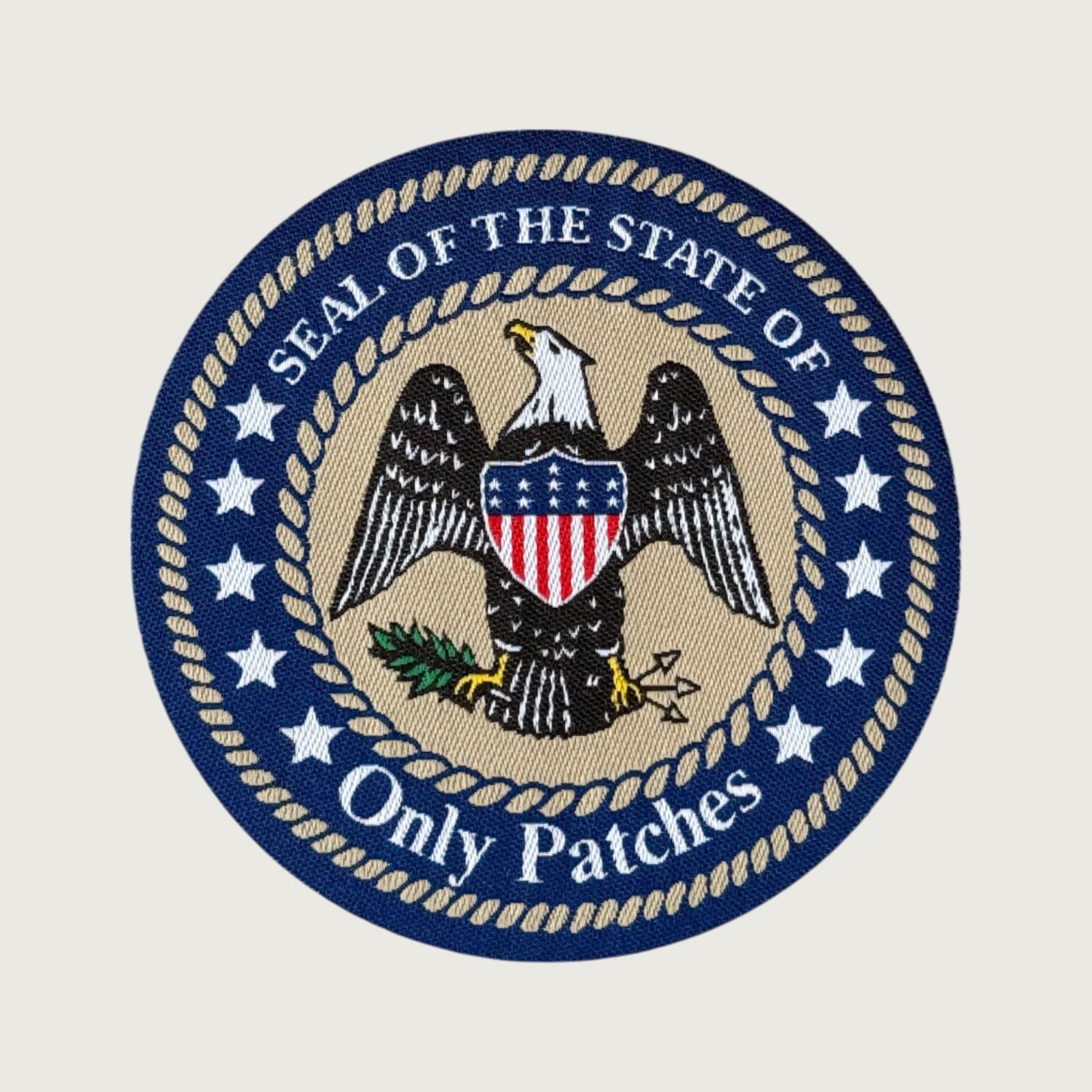 Custom woven patch – Seal of the State of Only Patches design with fine thread detail, ideal for jackets, bags, and custom branding by Only Patches