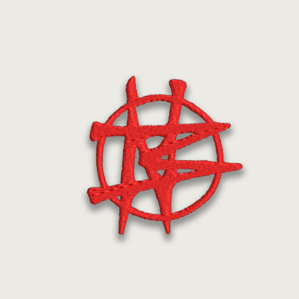 Red embroidered patch with an abstract symbol design resembling a modern artistic or logo-style circle and lines
