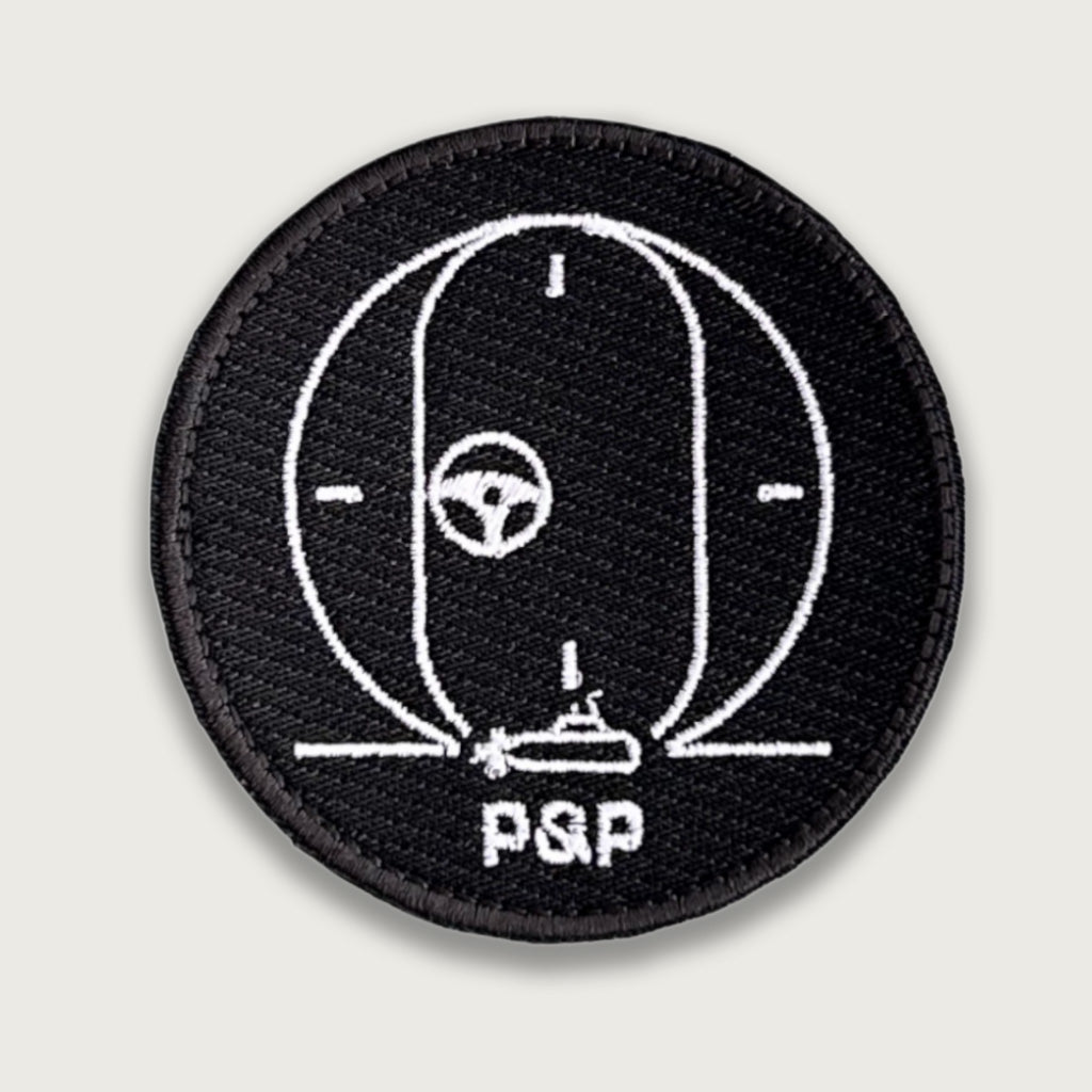 Embroidered submarine patch – White line art of periscope view with torpedo targeting and “PSP” text on black background