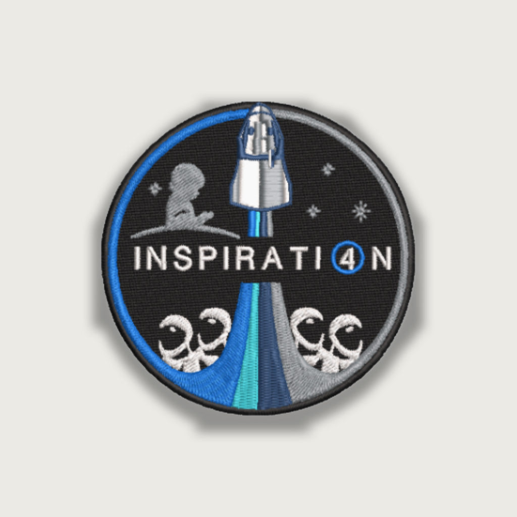Inspiration4 embroidered mission patch featuring Crew Dragon launch, St. Jude silhouette, stars, and symbolic rocket plume