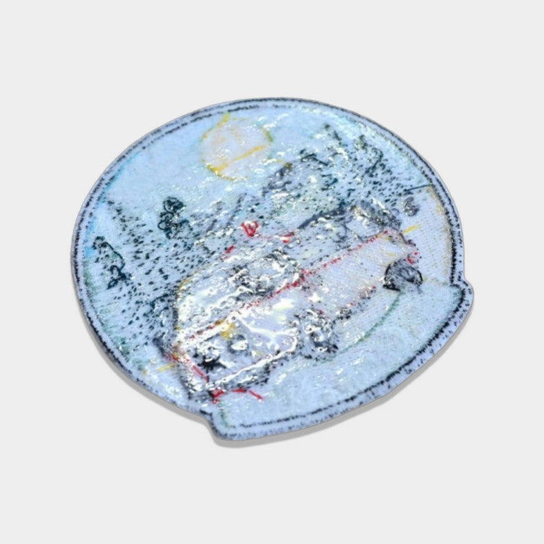 Backside of a patch with iron-on backing, featuring heat-activated adhesive for easy application with an iron.