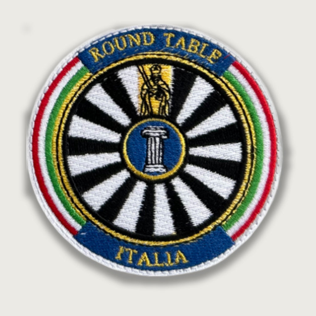 Round Table Italia embroidered patch featuring a black and white wheel, Roman column center, and Italian tricolor border. Inspired by the Knights of the Round Table, symbolizing unity and tradition.