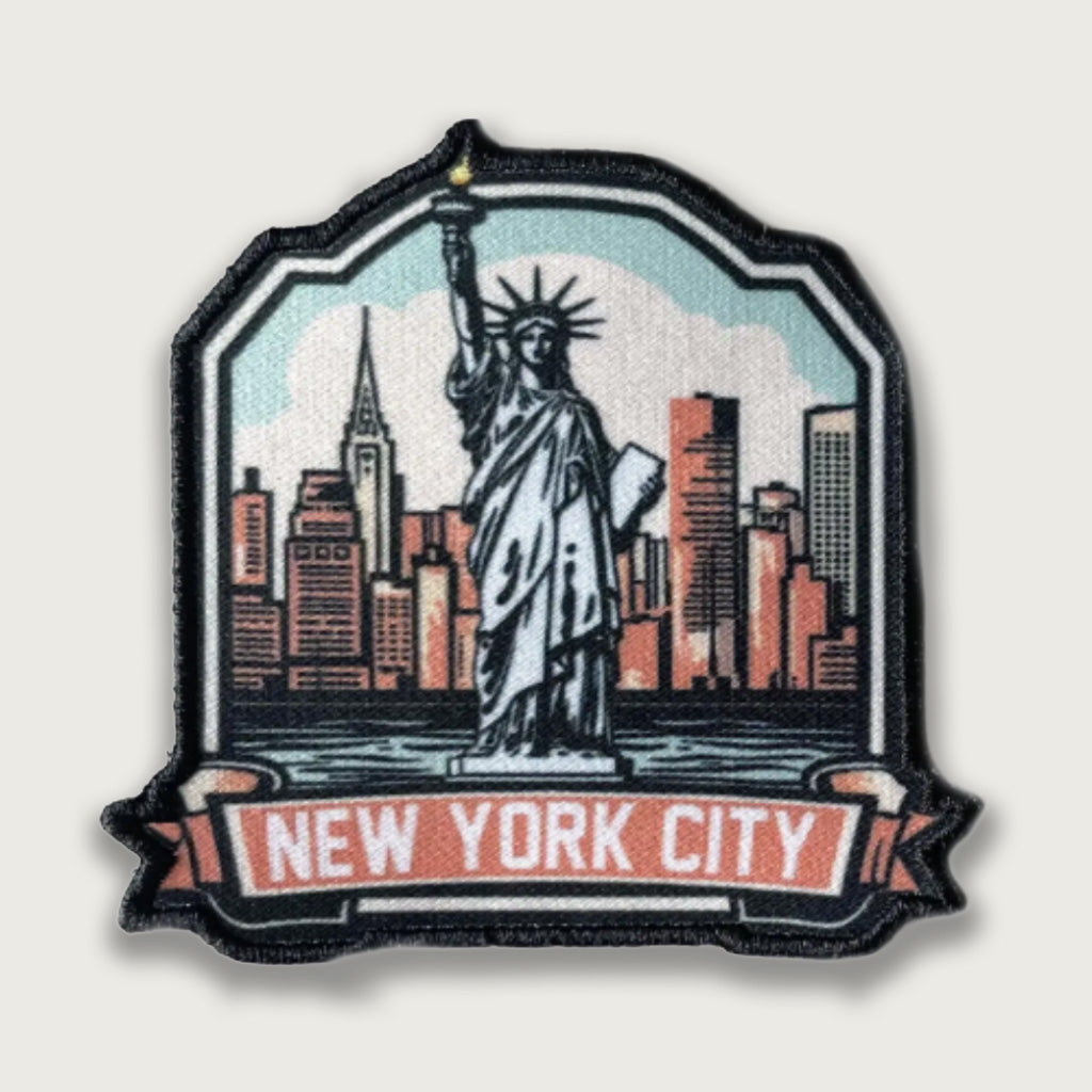 Sublimated patch featuring the Statue of Liberty with the New York City skyline in the background, labeled "New York City" in bold lettering. Iconic travel souvenir with detailed design and vibrant urban colors.